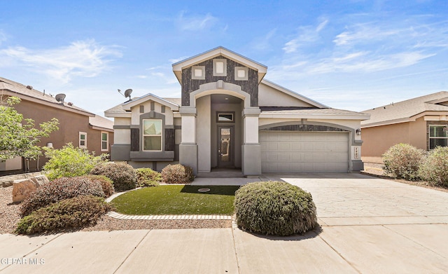 1117 Marathon Pl, El Paso, TX 79928 - view of front of home with stucco siding, driveway, a garage, and a front lawn