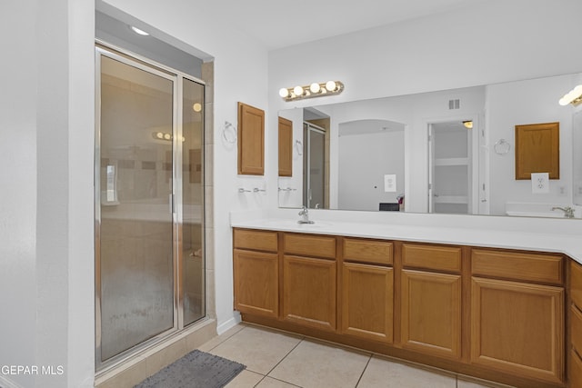 1497 Dunlin Pl, El Paso, TX 79928 - bathroom with tile patterned flooring, a shower stall, and double vanity