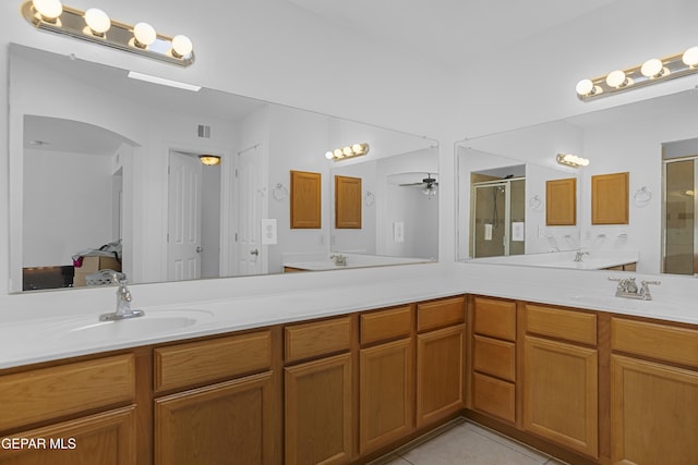 1497 Dunlin Pl, El Paso, TX 79928 - full bathroom featuring a stall shower, double vanity, ensuite bath, ceiling fan, and tile patterned floors