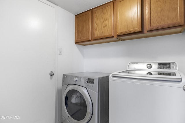 1497 Dunlin Pl, El Paso, TX 79928 - laundry area featuring cabinet space and washer and dryer
