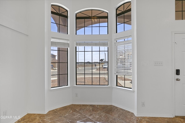 1497 Dunlin Pl, El Paso, TX 79928 - empty room featuring healthy amount of natural light and a high ceiling