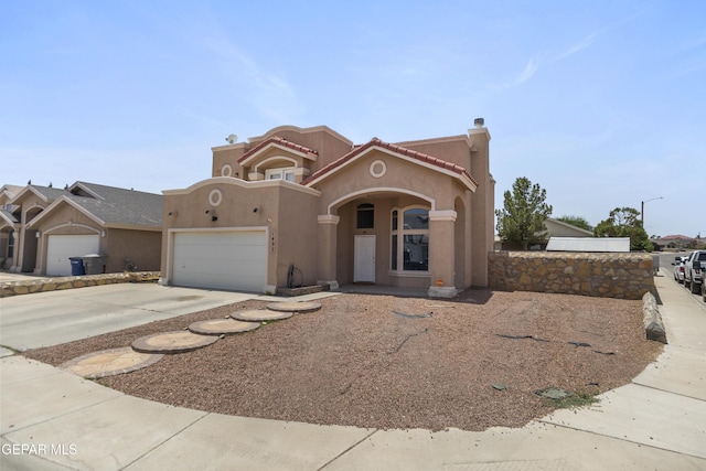 1497 Dunlin Pl, El Paso, TX 79928 - view of front of property featuring stucco siding, driveway, a garage, and a tile roof