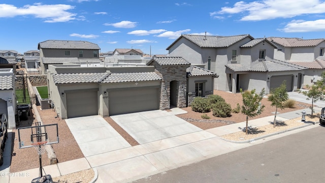 13727 Harbottle St, El Paso, TX 79928 - mediterranean / spanish home with a tiled roof, stucco siding, a garage, a residential view, and concrete driveway