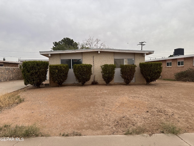 5537 Vancouver St, El Paso, TX 79924 - view of front of house featuring brick siding and central AC unit