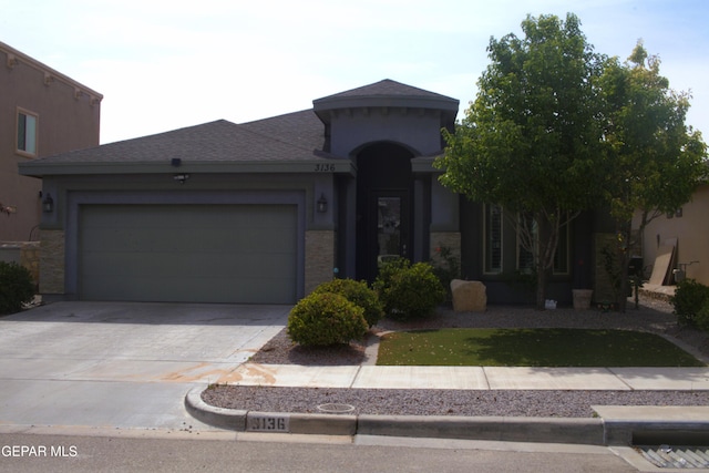 3136 Red Crk, El Paso, TX 79938 - view of front facade featuring concrete driveway, a garage, stucco siding, and a shingled roof