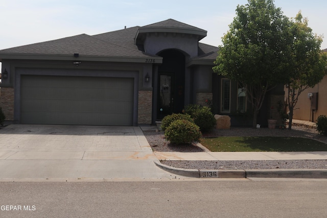 3136 Red Crk, El Paso, TX 79938 - view of front of house with concrete driveway, a shingled roof, a garage, and stucco siding