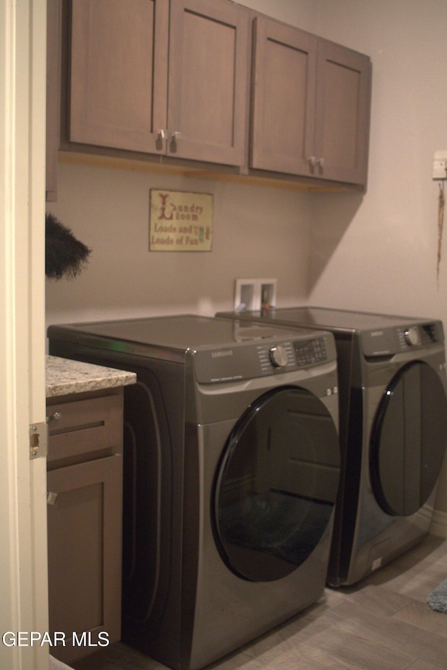 3136 Red Crk, El Paso, TX 79938 - washroom with independent washer and dryer and cabinet space
