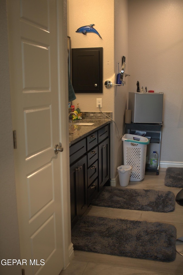 3136 Red Crk, El Paso, TX 79938 - bathroom with vanity and baseboards