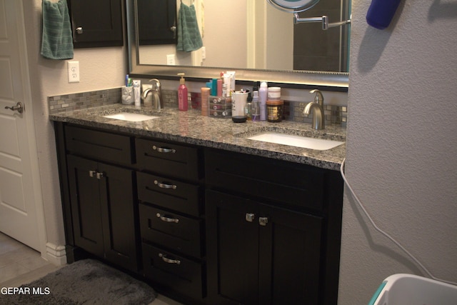 3136 Red Crk, El Paso, TX 79938 - full bathroom featuring double vanity, tile patterned flooring, and decorative backsplash