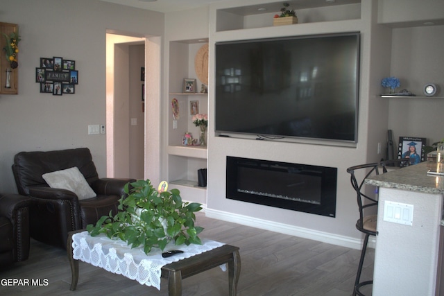 3136 Red Crk, El Paso, TX 79938 - living area featuring wood finished floors and built in features