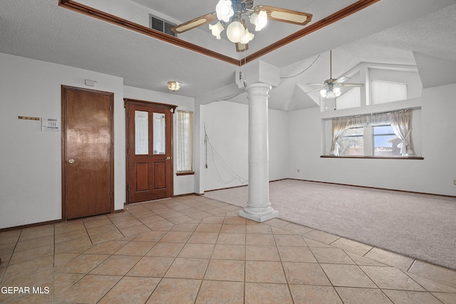 4513 Gen Maloney Cir, El Paso, TX 79924 - foyer featuring a ceiling fan, ornate columns, light colored carpet, vaulted ceiling, and light tile patterned floors