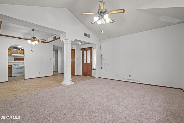 4513 Gen Maloney Cir, El Paso, TX 79924 - unfurnished living room featuring ceiling fan, ornate columns, light colored carpet, light tile patterned floors, and high vaulted ceiling