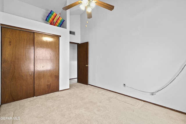 4513 Gen Maloney Cir, El Paso, TX 79924 - unfurnished bedroom with carpet flooring, a closet, a towering ceiling, baseboards, and a ceiling fan