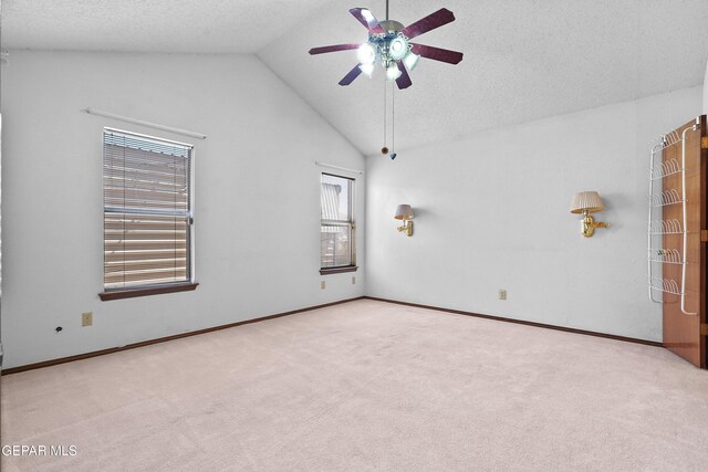 4513 Gen Maloney Cir, El Paso, TX 79924 - carpeted empty room with ceiling fan, vaulted ceiling, baseboards, and a textured ceiling