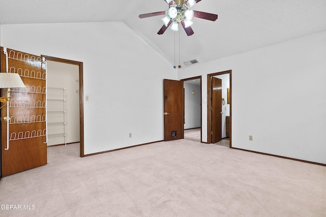 4513 Gen Maloney Cir, El Paso, TX 79924 - unfurnished bedroom with a walk in closet, vaulted ceiling, carpet floors, baseboards, and ceiling fan