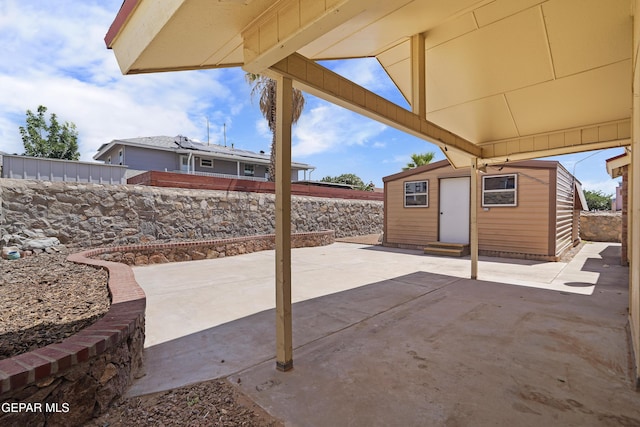 4513 Gen Maloney Cir, El Paso, TX 79924 - fenced backyard featuring a patio area, an outbuilding, and entry steps