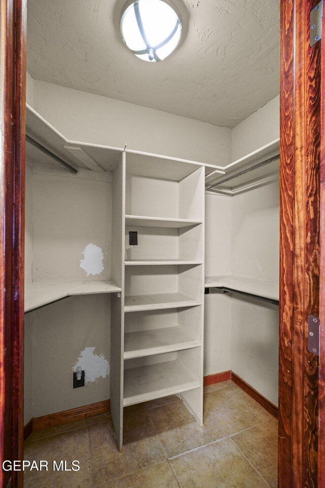 5300 Crawford Rd, Santa Teresa, NM 88008 - spacious closet with tile patterned floors
