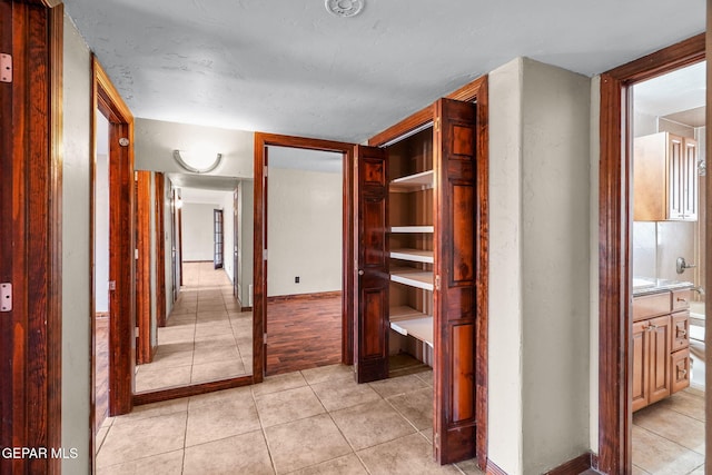 5300 Crawford Rd, Santa Teresa, NM 88008 - hall featuring light tile patterned floors and baseboards