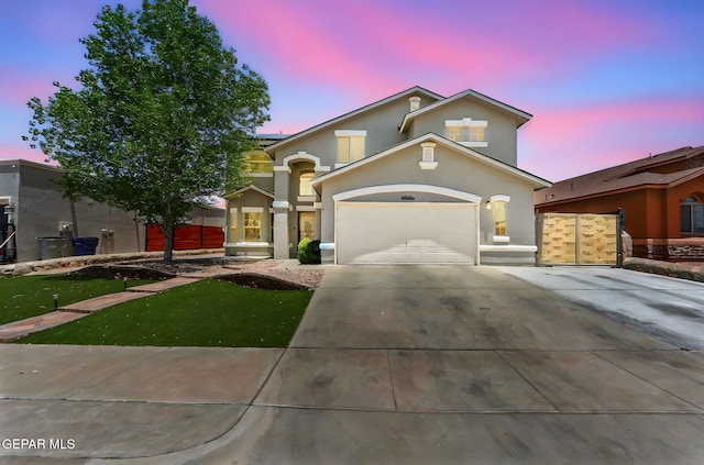 14045 Tower Point Way, El Paso, TX 79938 - mediterranean / spanish-style home with stucco siding, driveway, an attached garage, and roof mounted solar panels