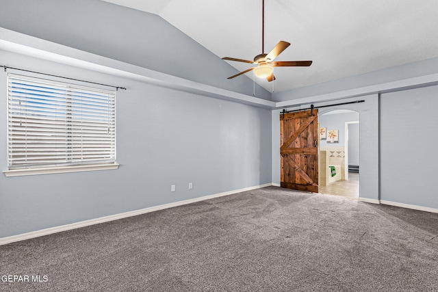 14045 Tower Point Way, El Paso, TX 79938 - unfurnished bedroom with lofted ceiling, carpet, a barn door, arched walkways, and baseboard heating