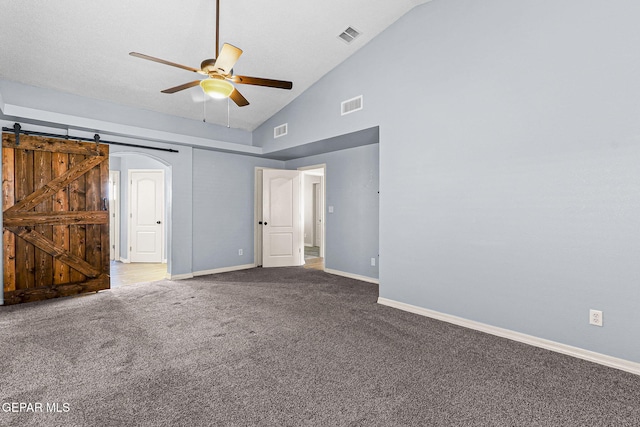 14045 Tower Point Way, El Paso, TX 79938 - unfurnished bedroom featuring carpet, baseboards, a barn door, a ceiling fan, and high vaulted ceiling