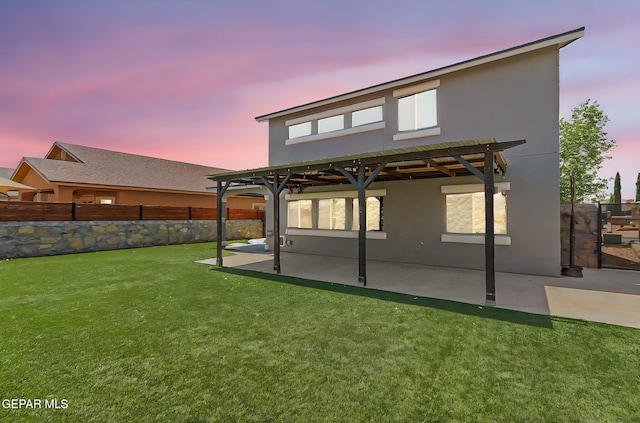 14045 Tower Point Way, El Paso, TX 79938 - back of property at dusk featuring stucco siding and a patio area