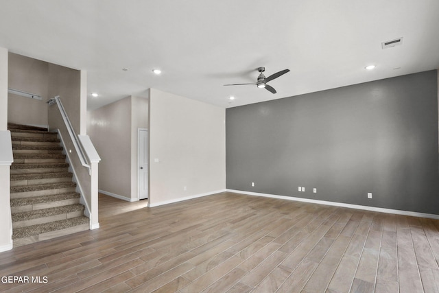 3952 Aspiration St, El Paso, TX 79938 - unfurnished living room featuring a ceiling fan, wood finished floors, stairs, baseboards, and recessed lighting