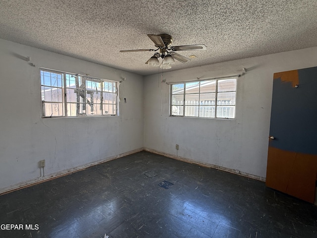 5609 Venezuela Rd, El Paso, TX 79903 - unfurnished room with plenty of natural light, a textured ceiling, and ceiling fan