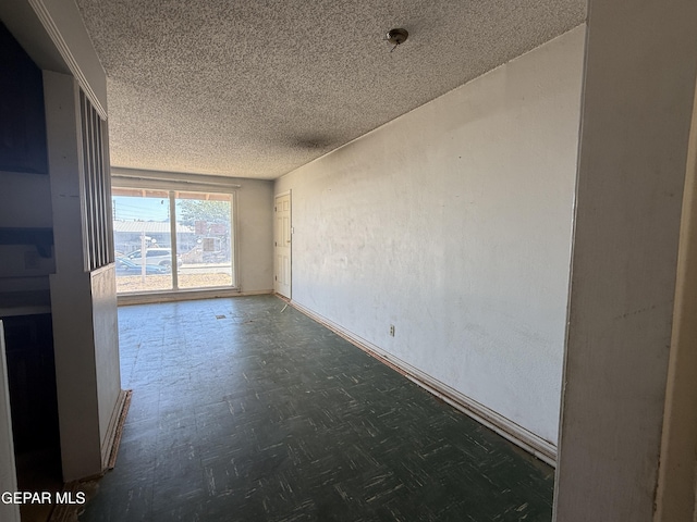 5609 Venezuela Rd, El Paso, TX 79903 - empty room featuring a textured ceiling and baseboards