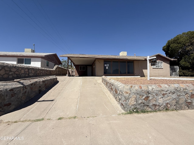 5609 Venezuela Rd, El Paso, TX 79903 - view of front of house with driveway and a carport