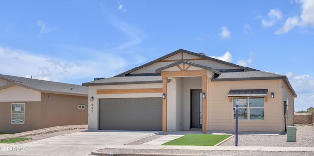 13873 Madero Ave, Horizon City, TX 79928 - view of front of property featuring a garage, concrete driveway, and roof with shingles