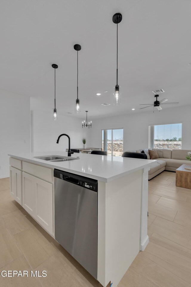 13873 Madero Ave, Horizon City, TX 79928 - kitchen featuring dishwasher, a center island with sink, white cabinets, open floor plan, and light countertops