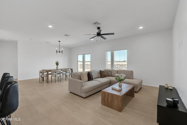 13873 Madero Ave, Horizon City, TX 79928 - living area featuring a chandelier, recessed lighting, and ceiling fan
