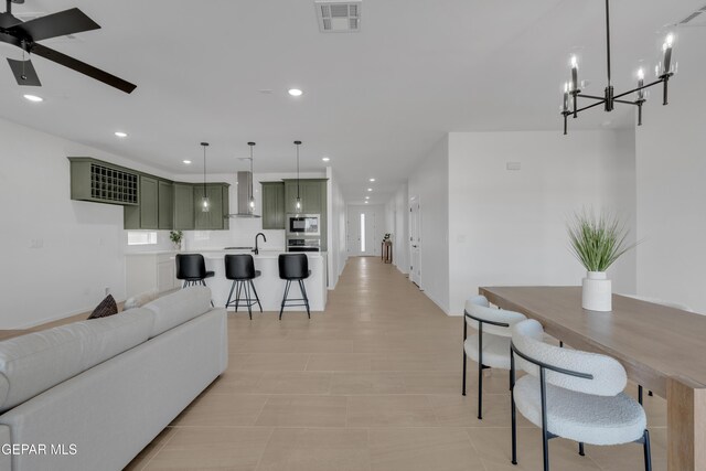 13873 Madero Ave, Horizon City, TX 79928 - living area featuring ceiling fan, recessed lighting, and a chandelier