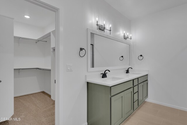 13873 Madero Ave, Horizon City, TX 79928 - bathroom with double vanity and a walk in closet