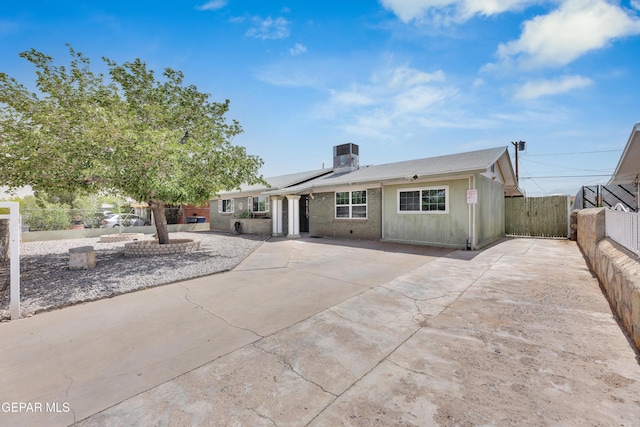 9549 Albany Dr, El Paso, TX 79924 - view of front of house with a patio, central air condition unit, and solar panels