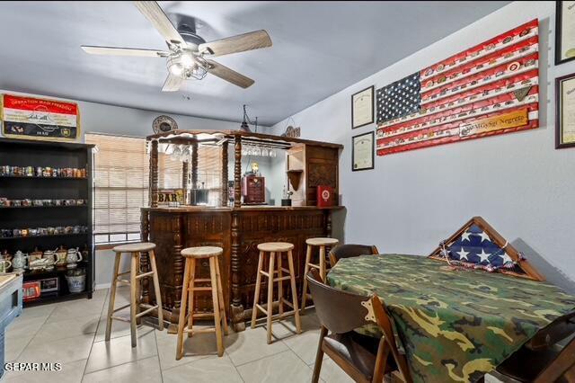 16006 Darley Dr, Horizon City, TX 79928 - indoor dry bar with tile patterned flooring and a ceiling fan