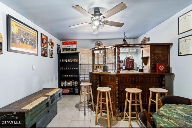 16006 Darley Dr, Horizon City, TX 79928 - indoor dry bar featuring ceiling fan and tile patterned floors