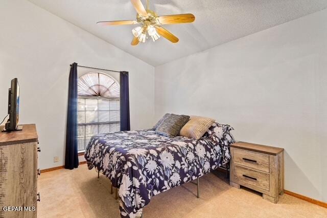 16006 Darley Dr, Horizon City, TX 79928 - bedroom featuring lofted ceiling, light carpet, baseboards, and a ceiling fan