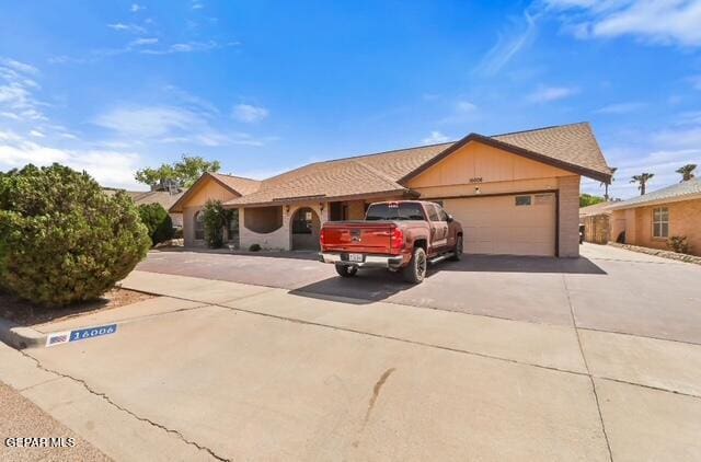 16006 Darley Dr, Horizon City, TX 79928 - ranch-style house with driveway and an attached garage