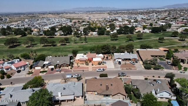 16006 Darley Dr, Horizon City, TX 79928 - aerial view of property's location featuring nearby suburban area, a local golf course, and a mountainous background