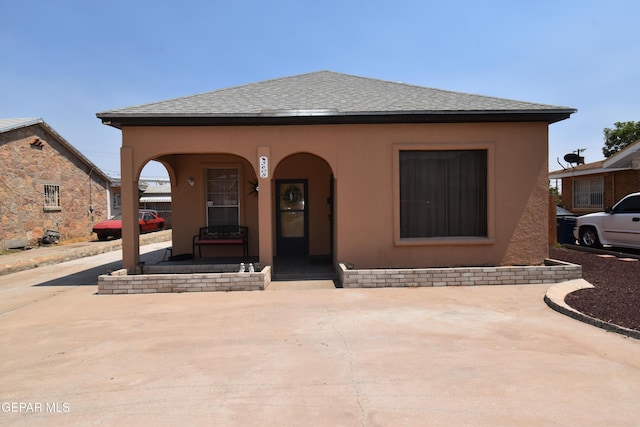 3608 Douglas Ave, El Paso, TX 79903 - view of front of property featuring a porch, stucco siding, and a shingled roof