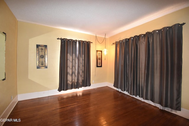 3608 Douglas Ave, El Paso, TX 79903 - unfurnished room featuring wood finished floors and baseboards