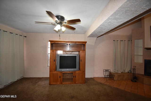 3608 Douglas Ave, El Paso, TX 79903 - unfurnished living room featuring ceiling fan, carpet, and a fireplace