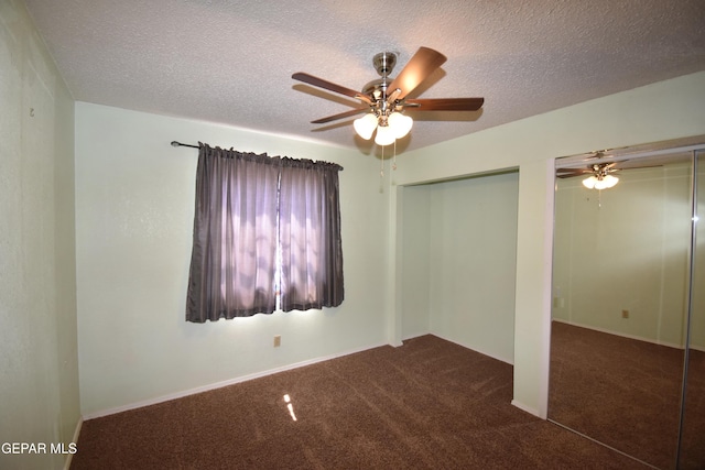 3608 Douglas Ave, El Paso, TX 79903 - unfurnished bedroom with carpet, a textured ceiling, two closets, and ceiling fan