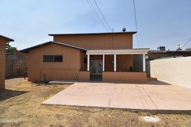 3608 Douglas Ave, El Paso, TX 79903 - back of property with french doors, a patio, and stucco siding