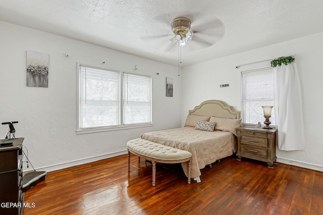 816 Ellis St, El Paso, TX 79903 - bedroom with dark wood-type flooring, baseboards, and a ceiling fan