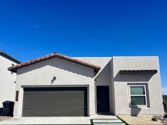 3928 Aspiration, El Paso, TX 79934 - view of front of house with a garage and stucco siding