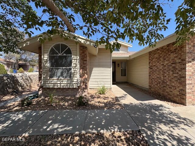 684 Abington Dr, El Paso, TX 79912 - doorway to property with brick siding