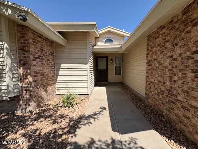 684 Abington Dr, El Paso, TX 79912 - doorway to property with brick siding